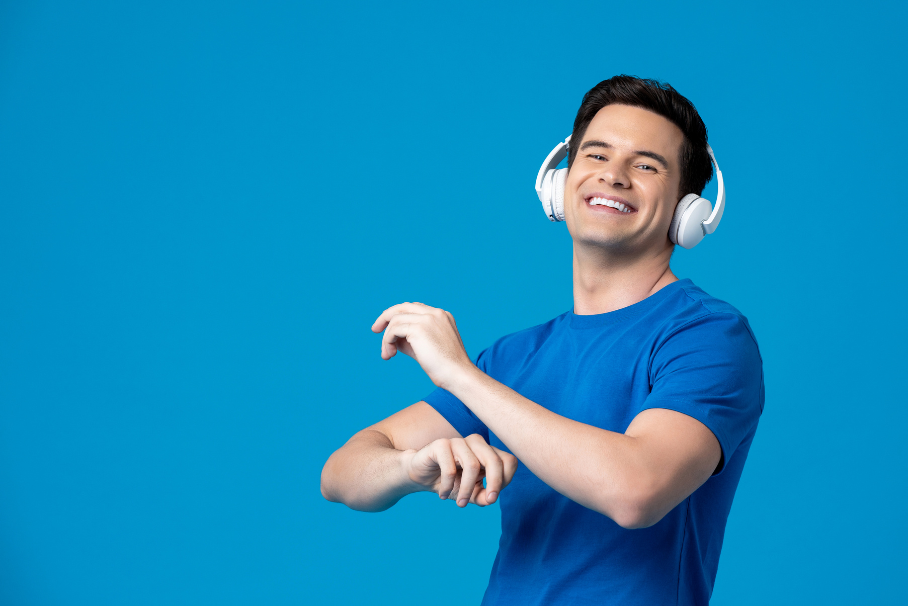 Smiling Man Listening and Dancing to Music